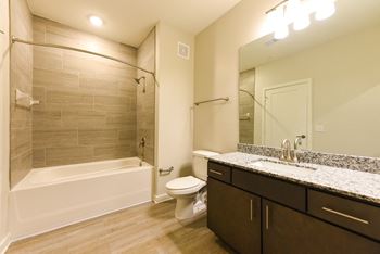Bathroom with soaking tub and undermount sink with tons of counter space at Pinnacle Apartments, Jacksonville, FL